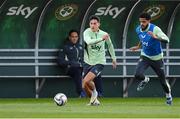 7 October 2024; Jamie McGrath and Andrew Omobamidele, rigth, during a Republic of Ireland training session at the FAI National Training Centre in Abbotstown, Dublin. Photo by Stephen McCarthy/Sportsfile