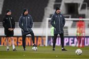 9 October 2024; Assistant head coach John O'Shea, right, assistant coach Paddy McCarthy and StatSport analyst Andrew Morrissey, left, during a Republic of Ireland training session at the Helsinki Olympic Stadium in Helsinki, Finland. Photo by Stephen McCarthy/Sportsfile
