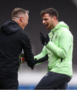 9 October 2024; Jayson Molumby and head of athletic performance Damien Doyle, left, during a Republic of Ireland training session at the Helsinki Olympic Stadium in Helsinki, Finland. Photo by Stephen McCarthy/Sportsfile