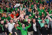 10 October 2024; Republic of Ireland supporters celebrate their side's winning goal, scored by Robbie Brady, not pictured, during the UEFA Nations League B Group 2 match between Finland and Republic of Ireland at the Helsinki Olympic Stadium in Helsinki, Finland. Photo by Stephen McCarthy/Sportsfile