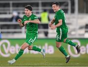 10 October 2024; Robbie Brady of Republic of Ireland celebrates with teammate Josh Cullen, right, after scoring his side's second goal during the UEFA Nations League B Group 2 match between Finland and Republic of Ireland at the Helsinki Olympic Stadium in Helsinki, Finland. Photo by Stephen McCarthy/Sportsfile