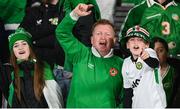 10 October 2024; Republic of Ireland supporters, from left, Faye, Andrew and Charlie Whelan, from Navan, Meath, celebrate after the UEFA Nations League B Group 2 match between Finland and Republic of Ireland at the Helsinki Olympic Stadium in Helsinki, Finland. Photo by Stephen McCarthy/Sportsfile