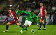 11 October 2024; Aidomo Emakhu of Republic of Ireland in action against Kristian Arnstad of Norway during the UEFA European U21 Championship qualifier match between Republic of Ireland and Norway at Turner's Cross in Cork. Photo by Brendan Moran/Sportsfile