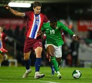 11 October 2024; Aidomo Emakhu of Republic of Ireland in action against Eivind Helland of Norway during the UEFA European U21 Championship qualifier match between Republic of Ireland and Norway at Turner's Cross in Cork. Photo by Brendan Moran/Sportsfile