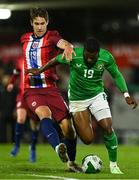 11 October 2024; Aidomo Emakhu of Republic of Ireland in action against Eivind Helland of Norway during the UEFA European U21 Championship qualifier match between Republic of Ireland and Norway at Turner's Cross in Cork. Photo by Brendan Moran/Sportsfile