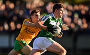 12 October 2024; Domhnaill Flynn of Mohill is tackled by Cathal McHugh of Ballinamore Sean O'Heslins during the Leitrim County Senior Club Football Championship final replay match between Ballinamore Seán O'Heslins and Mohill at Ballinamore Seán O'Heslin's GAA Club in Ballinamore, Leitrim. Photo by Ben McShane/Sportsfile