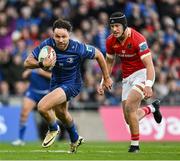 12 October 2024; Hugo Keenan of Leinster runs in past Mike Haley of Munster to score his side's third try during the United Rugby Championship match between Leinster and Munster at Croke Park in Dublin. Photo by Brendan Moran/Sportsfile