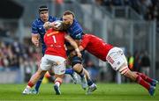 12 October 2024; RG Snyman of Leinster is tackled by Jeremy Loughman and Jean Kleyn of Munster during the United Rugby Championship match between Leinster and Munster at Croke Park in Dublin. Photo by Brendan Moran/Sportsfile