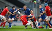 12 October 2024; RG Snyman of Leinster offloads to teammate James Ryan as he is tackled by Jeremy Loughman and Jean Kleyn of Munster during the United Rugby Championship match between Leinster and Munster at Croke Park in Dublin. Photo by Brendan Moran/Sportsfile