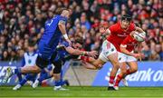 12 October 2024; Mike Haley of Munster is tackled by Jack Conan of Leinster during the United Rugby Championship match between Leinster and Munster at Croke Park in Dublin. Photo by Shauna Clinton/Sportsfile