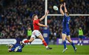 12 October 2024; Jack Crowley of Munster in action against Leinster players Garry Ringrose, right, and Caelan Doris during the United Rugby Championship match between Leinster and Munster at Croke Park in Dublin. Photo by Seb Daly/Sportsfile