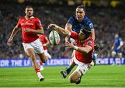12 October 2024; Mike Haley of Munster in action against James Lowe of Leinster during the United Rugby Championship match between Leinster and Munster at Croke Park in Dublin. Photo by Seb Daly/Sportsfile