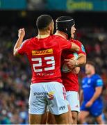 12 October 2024; Mike Haley of Munster is congratulated by team-mate Shay McCarthy after scoring his side's second try during the United Rugby Championship match between Leinster and Munster at Croke Park in Dublin. Photo by Shauna Clinton/Sportsfile