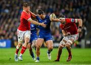 12 October 2024; James Lowe of Leinster in action against Munster players Jack O'Donoghue, left, and Tom Ahern during the United Rugby Championship match between Leinster and Munster at Croke Park in Dublin. Photo by Seb Daly/Sportsfile