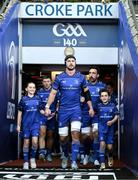 12 October 2024; Leinster captain Carlan Doris and mascots Juliette O'Gorman and Sam Curtis lead the team onto the pitch before the United Rugby Championship match between Leinster and Munster at Croke Park in Dublin. Photo by Brendan Moran/Sportsfile