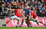 12 October 2024; Liam Turner of Leinster is tackled by Mike Haley and Jack O’Donoghue of Munster during the United Rugby Championship match between Leinster and Munster at Croke Park in Dublin. Photo by Brendan Moran/Sportsfile