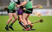 13 October 2024; Padhraic Linehan of Kilmacud Crokes in action against Liam Garrigan, left, and Ciarán Dowling of Lucan Sarsfields during the Dublin County Senior Club Hurling Championship semi-final match between Kilmacud Crokes and Lucan Sarsfields at Parnell Park in Dublin. Photo by Piaras Ó Mídheach/Sportsfile