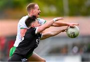 13 October 2024; David McEntee of Burren in action against Anthony Morgan of Kilcoo during the Down County Senior Club Football Championship final match between Burren and Kilcoo at Pairc Esler in Newry, Down. Photo by Shauna Clinton/Sportsfile