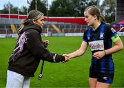 13 October 2024; Republic of Ireland international Jamie Finn presents a runners-up medal to Lucy Fitzgerald of Athlone Town after the EA SPORTS WU19 Cup match between Shelbourne and Athlone Town at Tolka Park in Dublin. Photo by Tyler Miller/Sportsfile
