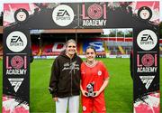 13 October 2024; Republic of Ireland international Jamie Finn presents Aoife Sheridan of Shelbourne with the player of the match award after the EA SPORTS WU19 Cup match between Shelbourne and Athlone Town at Tolka Park in Dublin. Photo by Tyler Miller/Sportsfile