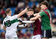 13 October 2024; Paul Cahillane of Portlaoise tussles with Cathal Bennett, left and Luke O'Reilly of Portarlington during the Laois County Senior Club Football Championship final match between Portlaoise and Portarlington at Laois Hire O'Moore Park in Portlaoise, Laois. Photo by Tom Beary/Sportsfile