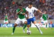 13 October 2024; Chiedozie Ogbene of Republic of Ireland in action against Konstantinos Mavropanos of Greece during the UEFA Nations League B Group 2 match between Greece and Republic of Ireland at Georgios Karaiskakis Football Stadium in Piraeus, Greece. Photo by Stephen McCarthy/Sportsfile