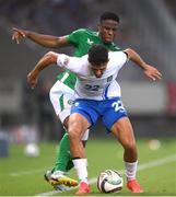 13 October 2024; Dimitris Giannoulis of Greece is tackled by Chiedozie Ogbene of Republic of Ireland during the UEFA Nations League B Group 2 match between Greece and Republic of Ireland at Georgios Karaiskakis Football Stadium in Piraeus, Greece. Photo by Stephen McCarthy/Sportsfile