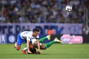 13 October 2024; Dimitris Giannoulis of Greece and Chiedozie Ogbene of Republic of Ireland collide during the UEFA Nations League B Group 2 match between Greece and Republic of Ireland at Georgios Karaiskakis Football Stadium in Piraeus, Greece. Photo by Stephen McCarthy/Sportsfile