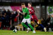 11 October 2024; Sam Curtis of Republic of Ireland in action against Mathias Fjortoft Lovik of Norway during the UEFA European U21 Championship qualifier match between Republic of Ireland and Norway at Turner's Cross in Cork. Photo by Ben McShane/Sportsfile