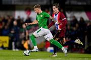 11 October 2024; Sam Curtis of Republic of Ireland in action against Mathias Fjortoft Lovik of Norway during the UEFA European U21 Championship qualifier match between Republic of Ireland and Norway at Turner's Cross in Cork. Photo by Ben McShane/Sportsfile