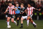 14 October 2024; Jack Henry-Francis of Sligo Rovers in action against Patrick McEleney, left, and Sean Robertson of Derry City during the SSE Airtricity Men's Premier Division match between Derry City and Sligo Rovers at The Ryan McBride Brandywell Stadium in Derry. Photo by Stephen McCarthy/Sportsfile