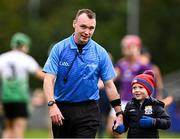 13 October 2024; Referee Thomas Gleeson, left, with his son Luke after the Dublin County Senior Club Hurling Championship semi-final match between Kilmacud Crokes and Lucan Sarsfields at Parnell Park in Dublin. Photo by Piaras Ó Mídheach/Sportsfile