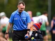 13 October 2024; Referee Thomas Gleeson, left, with his son Luke after the Dublin County Senior Club Hurling Championship semi-final match between Kilmacud Crokes and Lucan Sarsfields at Parnell Park in Dublin. Photo by Piaras Ó Mídheach/Sportsfile