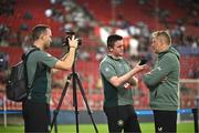 13 October 2024; Republic of Ireland head coach Heimir Hallgrimsson is interviewed by communications manager Kieran Crowley and multimedia executive Matthew Turnbull before the UEFA Nations League B Group 2 match between Greece and Republic of Ireland at Georgios Karaiskakis Football Stadium in Piraeus, Greece. Photo by Stephen McCarthy/Sportsfile