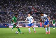 13 October 2024; Chiedozie Ogbene of Republic of Ireland in action against Christos Tzolisb and Dimitris Giannoulis, right, of Greece during the UEFA Nations League B Group 2 match between Greece and Republic of Ireland at Georgios Karaiskakis Football Stadium in Piraeus, Greece. Photo by Stephen McCarthy/Sportsfile