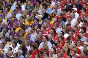 15 August 2004; Cork and Wexford supporters watch the match. Guinness Senior Hurling Championship Semi-Final, Wexford v Cork, Croke Park, Dublin. Picture credit; Ray McManus / SPORTSFILE