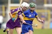 21 August 2004; Eimear McDonnell, Tipperary, in action against Aine Codd, Wexford. Foras na Gaeilge Senior Camogie Championship Semi-Final, Wexford v Tipperary, Nowlan Park, Kilkenny. Picture credit; Matt Browne / SPORTSFILE