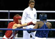 21 August 2004; Ireland's Andy Lee, left in red, in action against Hassan Ndam Njikam of Cameroon. Men's Middleweight (75kg), Preliminary round 2, Peristeri Olympic Boxing Hall. Games of the XXVIII Olympiad, Athens Summer Olympics Games 2004, Athens, Greece. Picture credit; Brendan Moran / SPORTSFILE