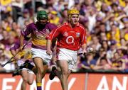 15 August 2004; Rory Jacob, Cork, in action against Keith Rossiter, Wexford. Guinness Senior Hurling Championship Semi-Final, Wexford v Cork, Croke Park, Dublin. Picture credit; Brian Lawless / SPORTSFILE