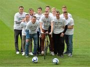 25 September 2013; Peter Cherrie, Dundalk, gets a push on his bike from League of Ireland team-mates, from left, Graham Gartland, Shelbourne, Raffaele Cretaro, Sligo Rovers, Barry Molloy, Derry City, James Chambers, Shamrock Rovers, Gearoid Morrissey, Cork City, Mick Leahy, UCD, Paul O'Connor, Drogheda United, Daire Doyle, Bray Wanderers, Jake Kelly, St. Patrick’s Athletic and Luke Byrne, Bohemians, during fundraising for Drogheda United striker Gary O’Neill who was diagnosed with testicular cancer. Picture credit: Matt Browne / SPORTSFILE