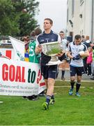 25 September 2013; Dublin captain Stephen Cluxton carries the Sam Maguire cup out to the fild before the GOAL Challenge charity match. Dublin Goal challenge, Parnell Park, Dublin.  Picture credit: Barry Cregg / SPORTSFILE