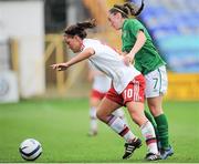 26 September 2013; Anna Frisker, Denmark, in action against Amy O'Connor, Republic of Ireland. UEFA Women’s U19 First Qualifying Round Group 2, Republic of Ireland v Denmark, Tolka Park, Dubin. Picture credit: Pat Murphy / SPORTSFILE