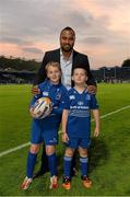 27 September 2013; Mascots Jamie McLoughlin, age 10, from Old Belvedere RFC, left, and Charlie Redmond Murray, age 8, from St Colmcilles SNS, Knocklyon, with Leinster's Leo Auva'a before the game. Celtic League 2013/14, Round 4, Leinster v Cardiff Blues, RDS, Ballsbridge, Dublin. Picture credit: Stephen McCarthy / SPORTSFILE