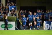 27 September 2013; Leinster captain Jamie Heaslip leads his side out with the team mascots Jamie McLoughlin, left, and Charlie Redmond Murray before the game. Celtic League 2013/14, Round 4, Leinster v Cardiff Blues, RDS, Ballsbridge, Dublin. Picture credit: Brendan Moran / SPORTSFILE