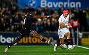18 October 2024; Mike Lowry of Ulster kicks on despite the efforts of Dan Kasende of Ospreys during the United Rugby Championship match between Ulster and Ospreys at Kingspan Stadium in Belfast. Photo by Shauna Clinton/Sportsfile