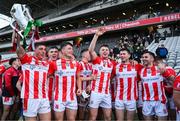 20 October 2024; Imokilly players, from left, Ciarán Joyce, Adam Murphy, Dáire O’Leary, Seamus Harnedy and Mike Kelly of Imokilly celebrate with the Sean Óg Murphy cup after the Cork County Senior Club Hurling Championship final match between Sarsfields and Imokilly at Páirc Ui Chaoimh in Cork. Photo by Brendan Moran/Sportsfile