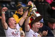 20 October 2024; Peter Smith, left, and Paddy Lynch of Crosserlough lift the trophy after the Cavan County Senior Club Football Championship final match between Crosserlough and Ramor United at Kingspan Breffni in Cavan. Photo by Ramsey Cardy/Sportsfile