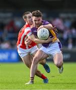 20 October 2024; Andrew McGowan of Kilmacud Crokes in action against Conor Groarke of Cuala during the Dublin County Senior Club Football Championship final match between Cuala and Kilmacud Crokes at Parnell Park in Dublin. Photo by Daire Brennan/Sportsfile
