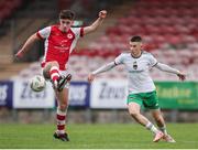 20 October 2024; Josh O'Connor of St Patrick’s Athletic in action against Cillian Murphy of Cork City during the EA SPORTS MU15 LOI Michael Hayes Cup match between Cork City and St Patrick’s Athletic at Turner’s Cross in Cork. Photo by Michael P Ryan/Sportsfile