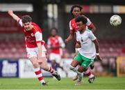 20 October 2024; Josh O'Connor of St Patrick’s Athletic in action against David Dunne of Cork City during the EA SPORTS MU15 LOI Michael Hayes Cup match between Cork City and St Patrick’s Athletic at Turner’s Cross in Cork. Photo by Michael P Ryan/Sportsfile